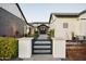 Beautiful black gate entry and landscaped front yard at 2752 E Pelican Ct, Gilbert, AZ 85297