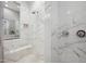 Detailed shot of a walk-in shower featuring white marble and modern shower fixtures, and a built in bench at 2752 E Pelican Ct, Gilbert, AZ 85297