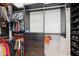 Walk-in closet with dark shelving and drawer organizers, and storage for shoes and clothing at 2752 E Pelican Ct, Gilbert, AZ 85297