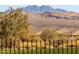 Desert landscape with mountain views and homes visible in the distance at 29215 N Horton Creek Trl, Rio Verde, AZ 85263