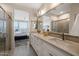 Double vanity bathroom with a view into the bedroom at 29215 N Horton Creek Trl, Rio Verde, AZ 85263