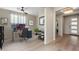 A cozy home office featuring a modern desk setup and a view into the home's entryway and hallway at 29215 N Horton Creek Trl, Rio Verde, AZ 85263