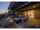 Covered patio with seating area and kitchen view at 29215 N Horton Creek Trl, Rio Verde, AZ 85263