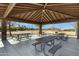 Covered picnic area with multiple tables and BBQ grill at 29402 W Mitchell Ave, Buckeye, AZ 85396