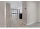 Bright entryway with tile flooring and view into the living room at 29402 W Mitchell Ave, Buckeye, AZ 85396