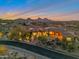 Luxury home with scenic mountain views at sunset, featuring a large backyard and pool at 29600 N 106Th N Pl, Scottsdale, AZ 85262