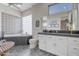 Modern bathroom with soaking tub, walk-in shower, and stylish vanity at 29600 N 106Th N Pl, Scottsdale, AZ 85262