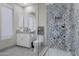 Modern bathroom with patterned tile shower and white cabinetry at 29600 N 106Th N Pl, Scottsdale, AZ 85262