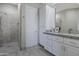 Elegant bathroom with a large walk-in shower and white cabinets at 29600 N 106Th N Pl, Scottsdale, AZ 85262