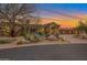 Beautiful home exterior at sunset with desert landscaping at 29600 N 106Th N Pl, Scottsdale, AZ 85262