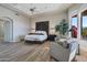 Main bedroom with unique headboard, sitting area and stunning views at 29600 N 106Th N Pl, Scottsdale, AZ 85262