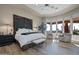 Main bedroom with unique headboard, sitting area, and stunning views at 29600 N 106Th N Pl, Scottsdale, AZ 85262