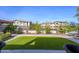 Landscaped backyard with artificial turf and community view at 29606 N 21 Dr, Phoenix, AZ 85085