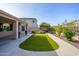 Landscaped backyard with artificial turf and walkway at 29606 N 21 Dr, Phoenix, AZ 85085