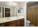 Bathroom with double sinks and shower/tub combo at 29606 N 21 Dr, Phoenix, AZ 85085