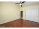 Bright bedroom with wood floors and double doors leading to the closet at 29606 N 21 Dr, Phoenix, AZ 85085