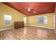 Bright bedroom featuring wood-look floors and ample natural light at 29606 N 21 Dr, Phoenix, AZ 85085