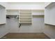 Large walk-in closet with ample shelving and hanging space at 29606 N 21 Dr, Phoenix, AZ 85085