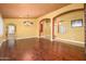 Formal dining room showcasing hardwood floors and access to other rooms at 29606 N 21 Dr, Phoenix, AZ 85085