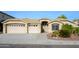 House exterior featuring a three-car garage and well-manicured landscaping at 29606 N 21 Dr, Phoenix, AZ 85085