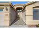 Home exterior showcasing a tiled walkway and entryway at 29606 N 21 Dr, Phoenix, AZ 85085