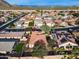 Aerial view of house and neighborhood with desert mountain views at 29762 N 69Th Ln, Peoria, AZ 85383