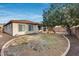 Landscaped backyard with playground and partial home view at 29762 N 69Th Ln, Peoria, AZ 85383