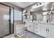 Elegant bathroom with double vanity and soaking tub at 29762 N 69Th Ln, Peoria, AZ 85383