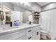 Bathroom with white cabinets, quartz countertops, and a modern design at 29762 N 69Th Ln, Peoria, AZ 85383