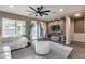 Bright living room featuring comfortable seating and a modern aesthetic at 29762 N 69Th Ln, Peoria, AZ 85383