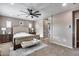 Main bedroom with ensuite bathroom access and large windows at 29762 N 69Th Ln, Peoria, AZ 85383