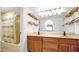 Double vanity bathroom with wood cabinets and a shower/tub at 3031 N Civic Center Plz # 317, Scottsdale, AZ 85251