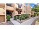 Attractive condo building exterior with landscaping and walkway at 3031 N Civic Center Plz # 317, Scottsdale, AZ 85251