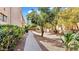 Landscaped walkway leads through a quiet condo community at 3031 N Civic Center Plz # 317, Scottsdale, AZ 85251