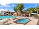 Community pool and spa with lounge chairs at 3031 N Civic Center Plz # 317, Scottsdale, AZ 85251