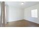 Bright bedroom with large window and polished concrete floor at 320 W Cypress St, Phoenix, AZ 85003