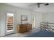 Bedroom with two doors leading to a balcony and a dresser at 320 W Cypress St, Phoenix, AZ 85003