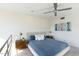 Main bedroom with large window, ceiling fan, and ensuite bathroom at 320 W Cypress St, Phoenix, AZ 85003