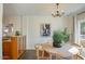 Bright dining area with wood table and chairs, featuring an elegant chandelier and large windows at 320 W Cypress St, Phoenix, AZ 85003