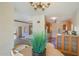 Open dining area with a view of the living room and kitchen, featuring a round table and plant decor at 320 W Cypress St, Phoenix, AZ 85003