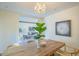 Open concept dining room with a rustic wooden table, offering a view of the living area at 320 W Cypress St, Phoenix, AZ 85003