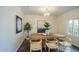 Bright dining room features a rustic wooden table with seating for six and a crystal chandelier at 320 W Cypress St, Phoenix, AZ 85003