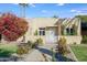 Cute stucco home with landscaped front yard, walkway, and white gate at 320 W Cypress St, Phoenix, AZ 85003