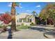 House exterior showcasing a large front yard with mature palm trees at 320 W Cypress St, Phoenix, AZ 85003