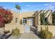 Updated stucco home with a landscaped front yard and white gate at 320 W Cypress St, Phoenix, AZ 85003