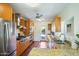 Updated kitchen featuring stainless steel appliances and wood cabinets at 320 W Cypress St, Phoenix, AZ 85003