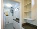 Laundry room with washer, dryer, and ample storage shelves at 320 W Cypress St, Phoenix, AZ 85003