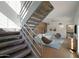 Living room with modern furniture, a stone accent wall, and floating staircase at 320 W Cypress St, Phoenix, AZ 85003