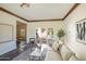 Sunlit living room with sectional sofa and access to backyard pool at 320 W Cypress St, Phoenix, AZ 85003