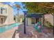 Relaxing patio area with pergola, seating, and lush landscaping at 320 W Cypress St, Phoenix, AZ 85003